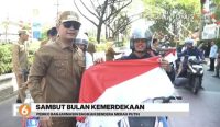 Pemko Banjarmasin membagikan ribuan bendera Merah Putih gratis kepada pengguna jalan